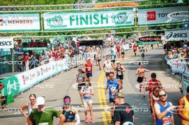 Stop-frame gif of Grandma's marathon finish line where Will and Alec cross the line together.