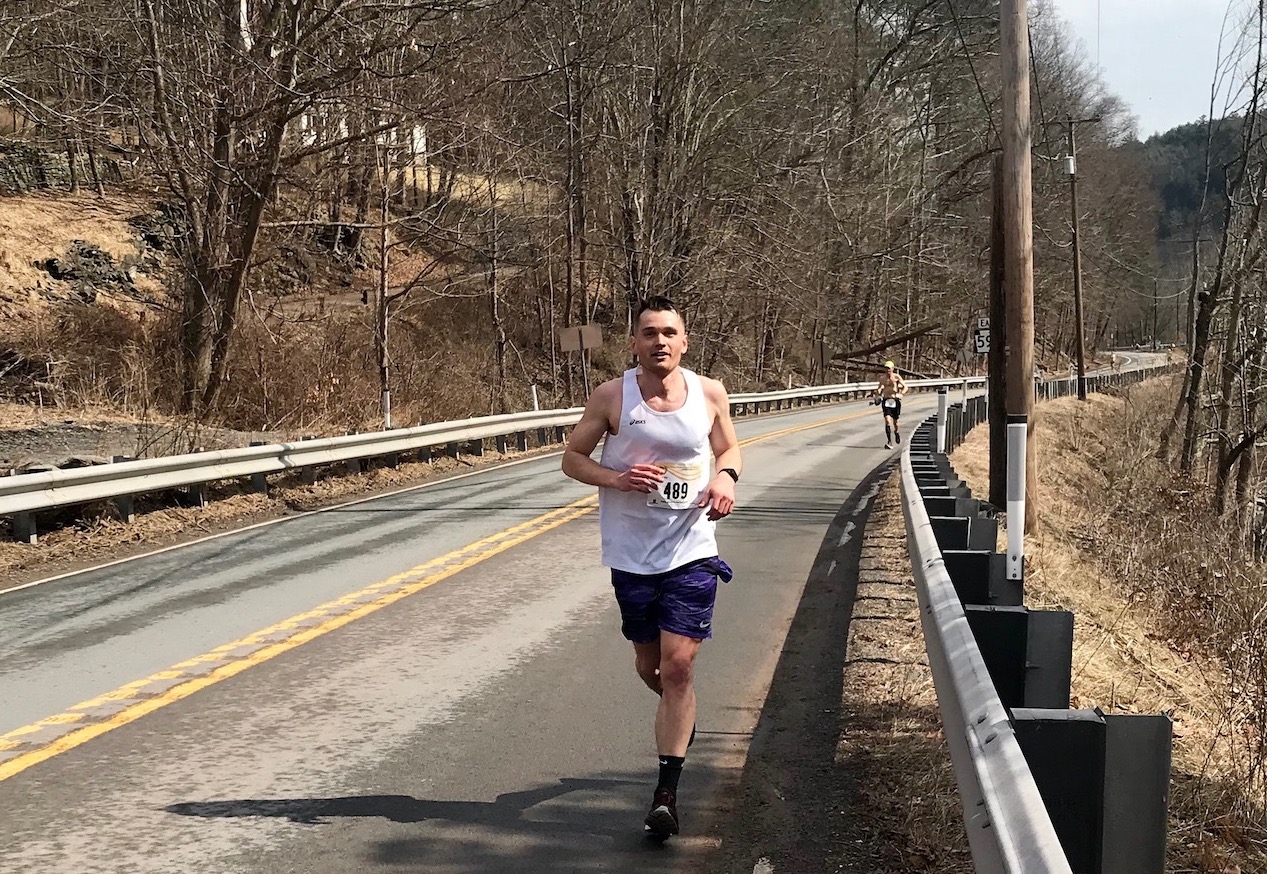 Will Vedder mid-stride in the Two Rivers Marathon in Lackawaxen PA